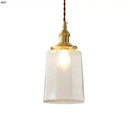 Modern brass and clear glass led pendant lamp for dining room by Decorbites