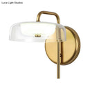 GobekUsa Post-Modern Gold LED Bedside Wall Sconce with Clear Glass Shade