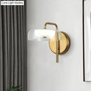 GobekUsa Post-Modern Gold LED Bedside Wall Sconce with Clear Glass Shade