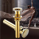 Modern brass and white ceramic basin waste drain bathroom sink stopper by Decorbites