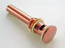 Modern brass and white ceramic basin waste drain bathroom sink stopper by Decorbites
