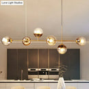 GobekUsa 6-Light Linear Dining Room Island Pendant with Postmodern Metallic Finish and Glass Ball Shades