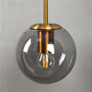Modern brass glass ball wall lamp bedroom amber globe lighting by Decorbites
