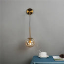 Modern brass glass ball wall lamp bedroom amber globe lighting by Decorbites