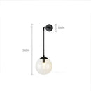 Modern brass glass ball wall lamp bedroom amber globe lighting by Decorbites