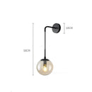 Modern brass glass ball wall lamp bedroom amber globe lighting by Decorbites