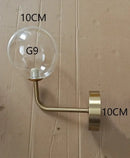 Modern brass glass ball wall lamp bedroom amber globe lighting by Decorbites
