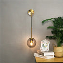 Modern brass glass ball wall lamp bedroom amber globe lighting by Decorbites