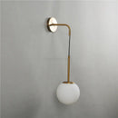 Modern brass glass ball wall lamp bedroom amber globe lighting by Decorbites