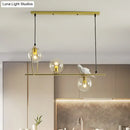 GobekUsa Modern Clear Glass Pendant Light Fixture with White Bird - Global Island Lamp, Gold Trim, 3 Heads
