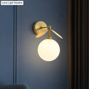GobekUsa Modern Globe/Oval Wall Mount Lamp with Cream Glass - Brass Bedside Wall Light with Leaf Deco