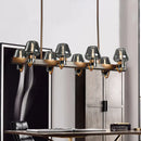 GobekUsa Modernist Clear/Amber/Smoke Glass Pendant Lamp with Linear Design - Cone Island Lighting (6/8 Lights, Black/Brass Ceiling)