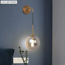 GobekUsa Sleek Silver Glass Ball Wall Hanging Lamp with Brass Mount - Perfect Bedroom Lighting Solution