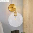 GobekUsa Modern Glass Orb Wall Sconce with Brass Arm, Clear/White