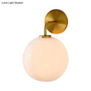 GobekUsa Modern Glass Orb Wall Sconce with Brass Arm, Clear/White