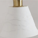 Modern brass wall lamp with frosted glass shade for bedroom reading by Decorbites