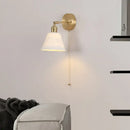 Modern brass wall lamp with frosted glass shade for bedroom reading by Decorbites