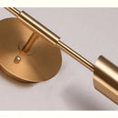 Modern brushed brass golden wall lamp for luxury bedroom decor by Decorbites