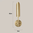 Modern brushed brass golden wall lamp for luxury bedroom decor by Decorbites