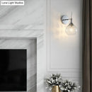 GobekUsa Contemporary Clear Glass Wall Sconce with Inner Crystal Strand and Chrome Finish