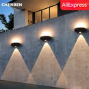 Modern circular black solar led wall light garden exterior decor by Decorbites