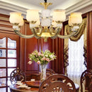 Modern copper jade pendant lamp for dining room decor by Decorbites