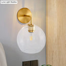 GobekUsa Modern Glass Orb Wall Sconce with Brass Arm, Clear/White