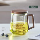 Modern glass tea cup with wood handle for kitchen drinking by Decorbites