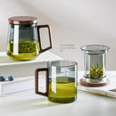 Modern glass tea cup with wood handle for kitchen drinking by Decorbites