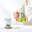 Modern glass tea cup with wood handle for kitchen drinking by Decorbites