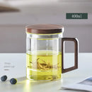 Modern glass tea cup with wood handle for kitchen drinking by Decorbites