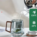 Modern glass tea cup with wood handle for kitchen drinking by Decorbites