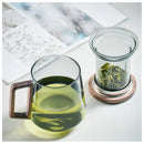 Modern glass tea cup with wood handle for kitchen drinking by Decorbites