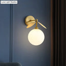 GobekUsa Modern Globe/Oval Wall Mount Lamp with Cream Glass - Brass Bedside Wall Light with Leaf Deco