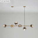 GobekUsa Contemporary Smoke Gray Glass Globe Hanging Light Fixture - 6 Head Gold Island Light