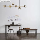 GobekUsa Contemporary Smoke Gray Glass Globe Hanging Light Fixture - 6 Head Gold Island Light