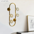 GobekUsa Gold Modern Wall Mount Light with Clear Crystal Shade and Oval Frame - 4 Bulb Wall Lighting Idea