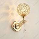 Modern gold crystal wall lamp bedroom spherical sconce decor by Decorbites