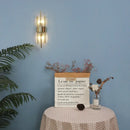 Modern gold crystal wall lamp for bedroom with vertical glass tubes by Decorbites