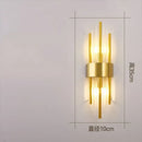 Modern gold crystal wall lamp for bedroom with vertical glass tubes by Decorbites