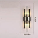 Modern gold crystal wall lamp for bedroom with vertical glass tubes by Decorbites