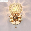 GobekUsa Globe Cutout Metal Shade Crystal Wall Sconce in Gold with Dropped Crystal Ball Accent