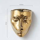 Modern gold face ceramic wall-mounted vase living room decor by Decorbites