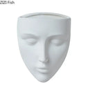 Modern gold face ceramic wall-mounted vase living room decor by Decorbites