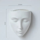 Modern gold face ceramic wall-mounted vase living room decor by Decorbites