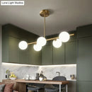 GobekUsa Sleek and Elegant Linear Gold Island Pendant Lighting with Spherical Glass Shades for Dining Table