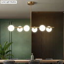 GobekUsa Sleek and Elegant Linear Gold Island Pendant Lighting with Spherical Glass Shades for Dining Table