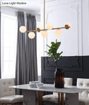 GobekUsa 7-Light Modern Gold Metal Island Pendant with Spherical White Glass - Ideal for Dining Table