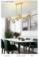 GobekUsa Mid-Century Modern Gold Metal Pendant with Spherical Amber Glass - Island Ceiling Light for Dining Table