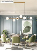 GobekUsa Modern Gold Metal Island Pendant Lighting with 6 Lights and Spherical Glass for Dining Table